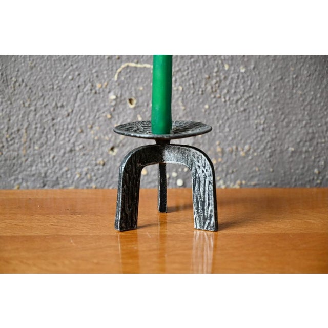 This candleholder is worked in a raw spirit. It is a powerful decorative piece, in a spirit close to the material. The...