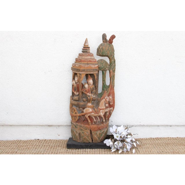 This striking piece is a historical narrative carved in wood, a fragment of high drama and spiritual artistry. This...