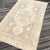 A Neutral Vintage Kazak Rug with Timeless Geometric Design This beautiful vintage Kazak rug was handwoven approximately 80...