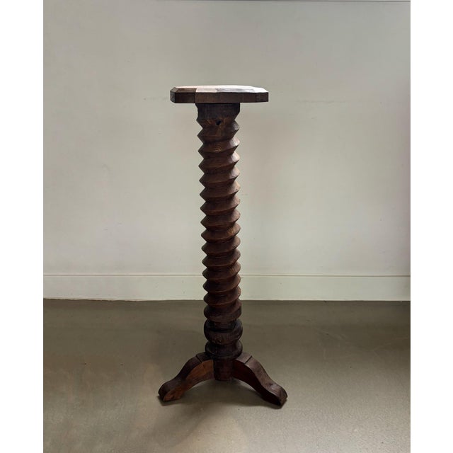 Brutalist, rustic pedestal made of solid wood. Turned pilar, hand-carved looking like traditional, wooden screw of an...