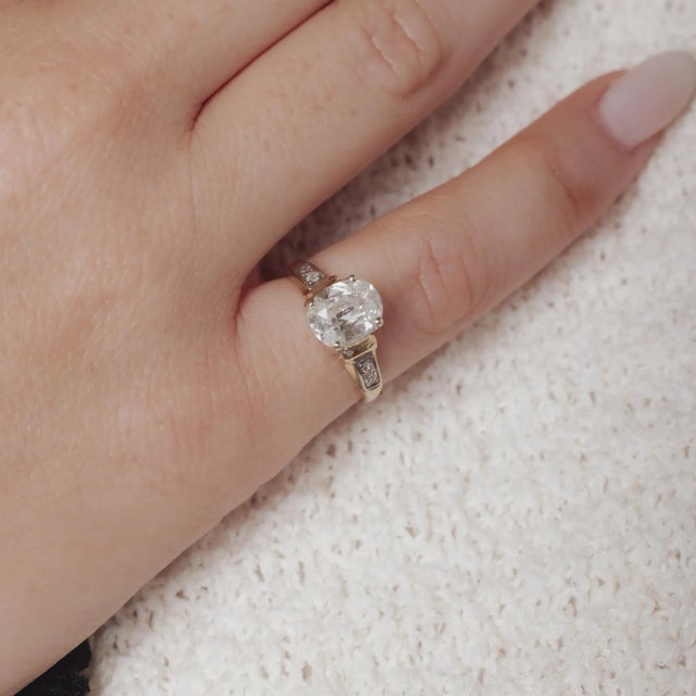 This Retro ring from the 1940’s is crafted in 14k yellow and white gold and showcases a GIA certified cushion cut diamond...