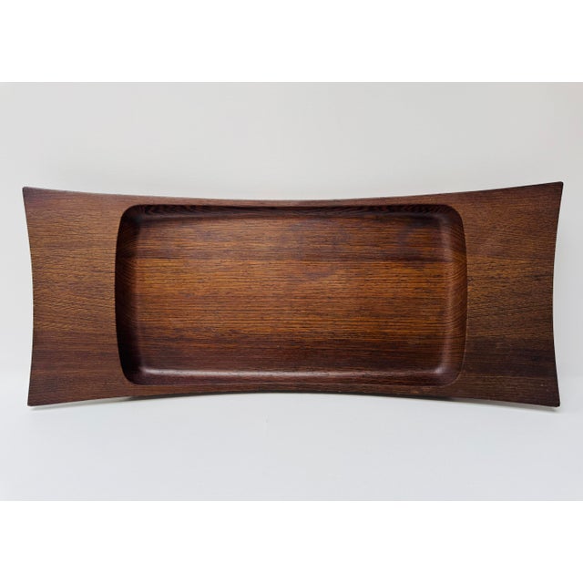 This beautiful Dansk serving tray was designed by Jens Quistgaard and bears the faint but legible stamp on the underside....