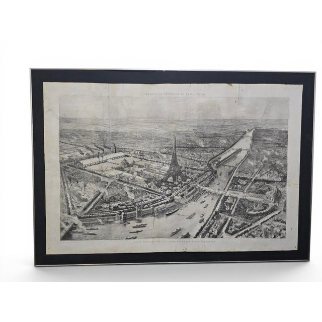 An impressive large-format panoramic engraving depicting the Exposition Universelle held in Paris in 1889, dominated by...
