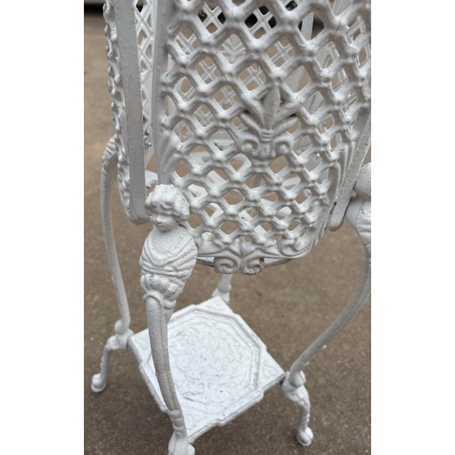Lovely French iron planter with cherub design on legs