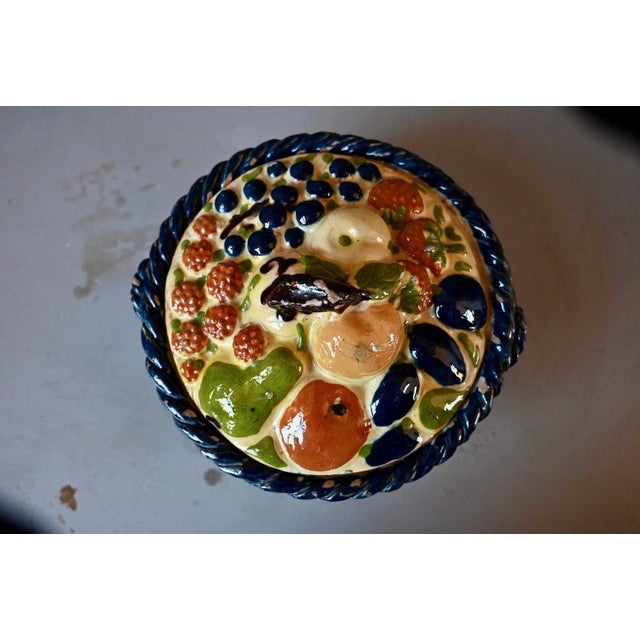 This magnificent polychrome terracotta fruit bowl blends fruits from Alsatian orchards: grapes, pears, apples, plums,...