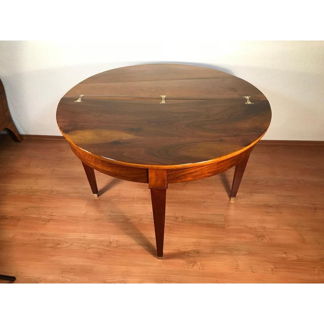 Biedermeier Demi-Lune Table, Germany, circa 1820 This elegant Biedermeier demi-lune table dates to circa 1820 and...