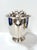 Bold vintage silver-plated ice bucket featuring sculptural stag head handles, creating a striking lodge-inspired barware...