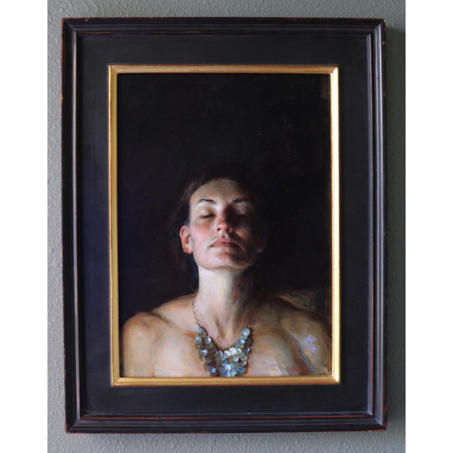 In "Glow," a serene figure emerges against a deep, dark background, evoking a sense of introspection and tranquility. The...