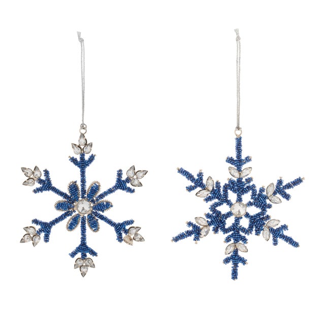 Add a touch of glamour and wintry charm to your tree with the Beaded Metal Snowflake Ornament. Featuring wintry blue and...