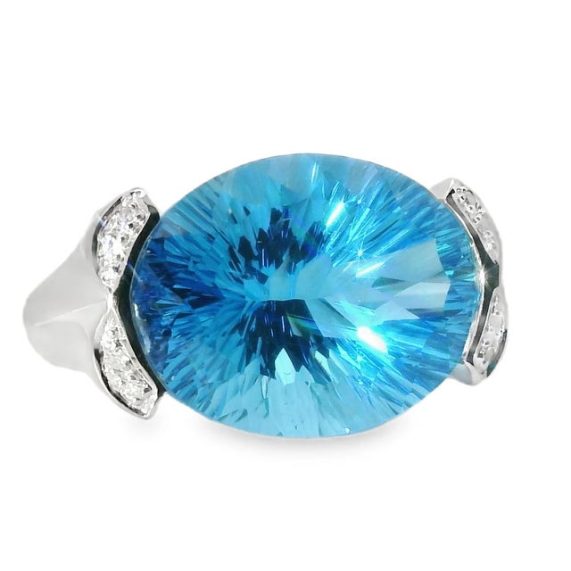 14K White Gold Huge Blue Topaz Diamond Ring Make a statement with this bold 14K white gold ring, featuring a stunning...
