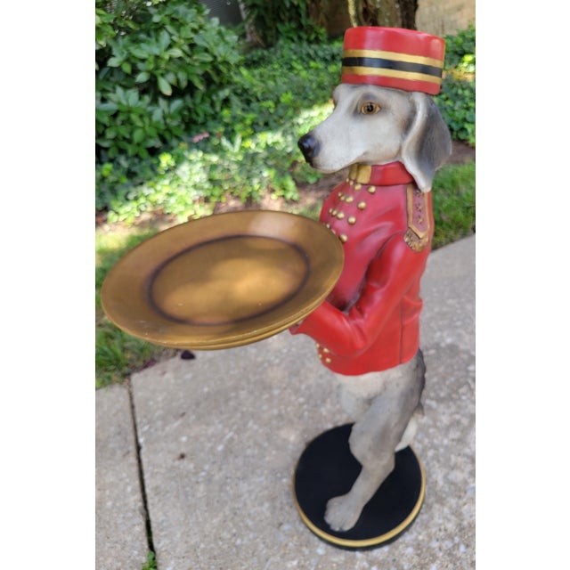 Bombay Company "Dudley the Bellhop Dog" Butler Tray mounted on a round disc base. DIMENSIONS: 16.5 in diameter x 30.75 in...
