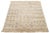 This hand-knotted organic Moroccan wool rug features a light brown field with beige and gray accents in a geometric...