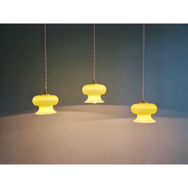 Trio of vintage opaline green pendant/portable lamps from the 1960s-70s. Each lamp has been fully restored and is...