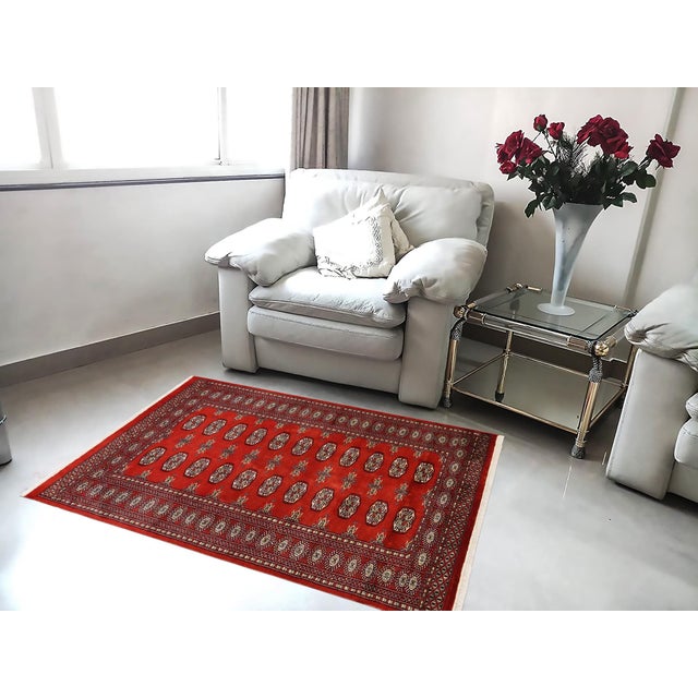 Transform the interior of your home with a beautiful hand-knotted Bokhara rug. Meticulously crafted with intricate...