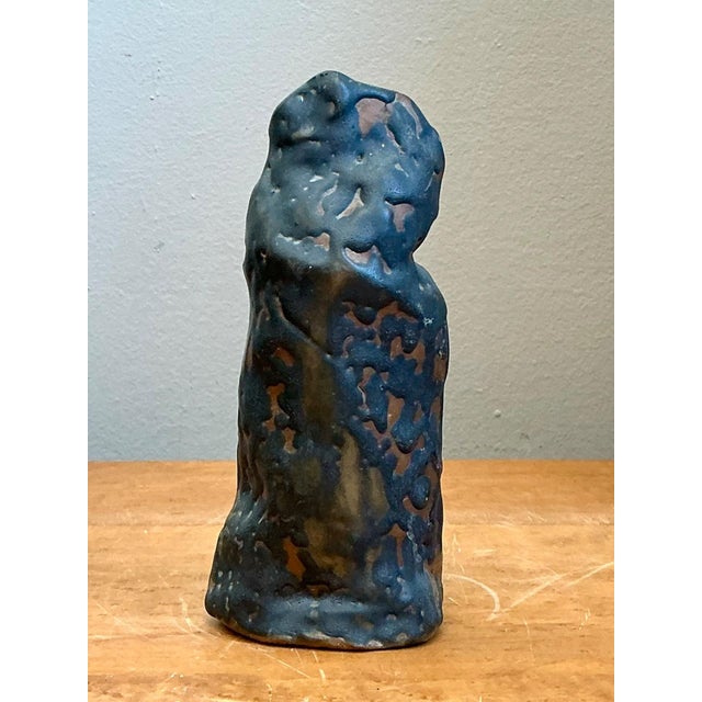 This vintage abstract ceramic vase exemplifies the expressive artistry of mid-century studio pottery, where sculptural...