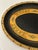 Stylish mid-century oval metal tray featuring a hand-painted ornate motif with burnished gold accents on a faux leather...