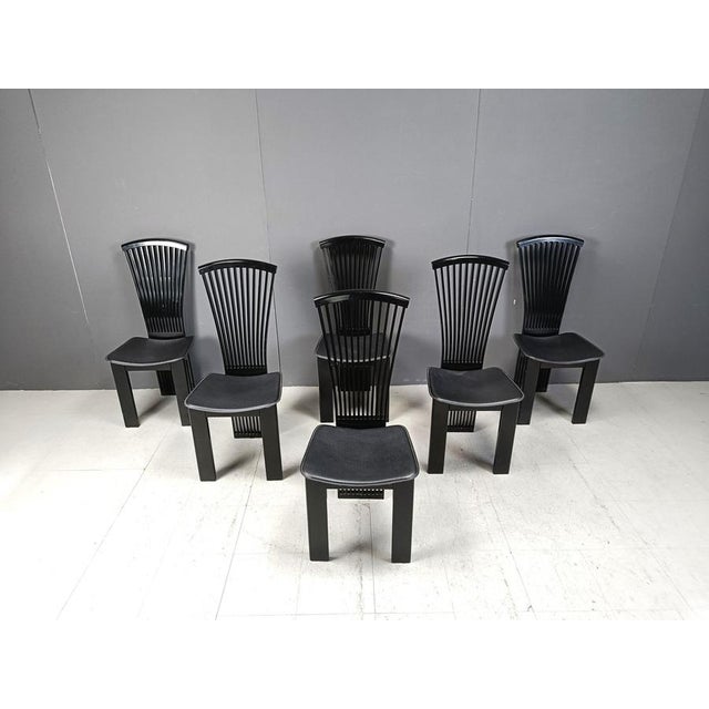 Very chic italian high back dining chairs designed by Pietro Costantini. Elegant curved lacquered wood backrests and...