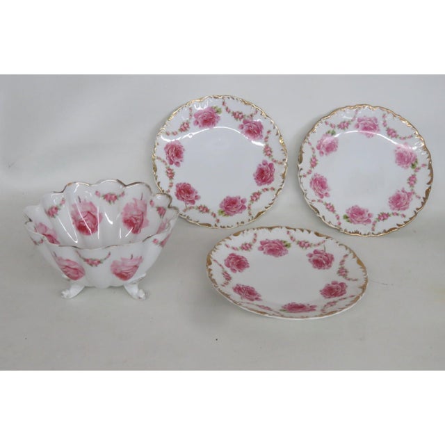 This gorgeous 4pc Dish Set is made of porcelain. This stunning set features a matching pink rose motif of with various...