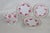 This gorgeous 4pc Dish Set is made of porcelain. This stunning set features a matching pink rose motif of with various...