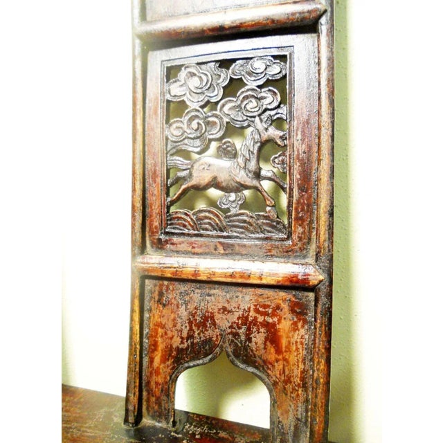 This style of chair is known as "official's hat chair" because the projections over the rear stiles resemble the knobs on...