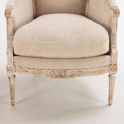 A Pair of French Louis XVI Style Upholstered and Painted Bergere