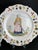 Beautiful and rare set of three hand-painted faience plates from Malicorne, decorated in traditional Breton costume style....