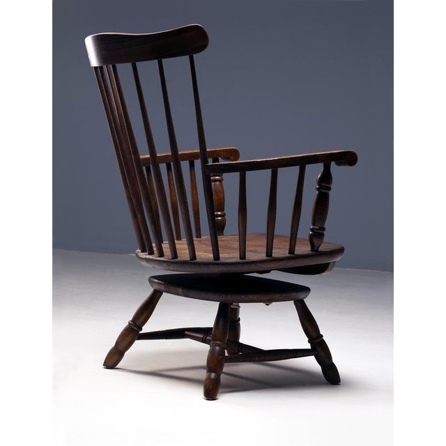 A pair of swivel chairs from the 1970s featuring a minimalist and functional design typical of late modernist Czechoslovak...