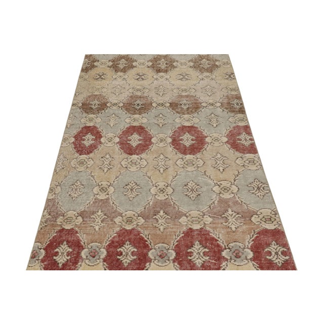 This vintage runner rug is a 4x9 Turkish distressed piece, made with hand-knotted wool circa mid-20th century. It is an...
