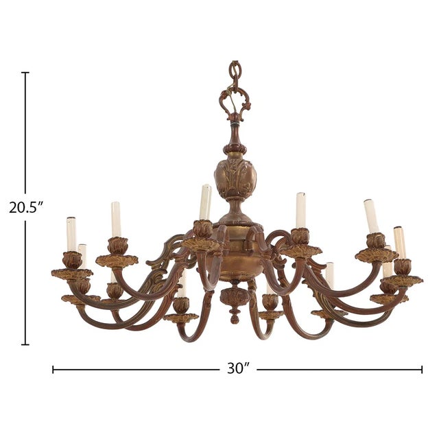 A striking French twelve-arm bronze chandelier in the Baroque style, dating to circa 1910. Rich in movement and detail,...