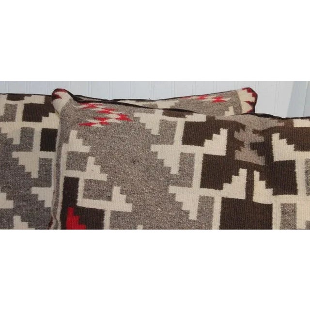 Pair of bolster Geometric Pillows with unusual color. The V shape design in the center and corners representing mountains....