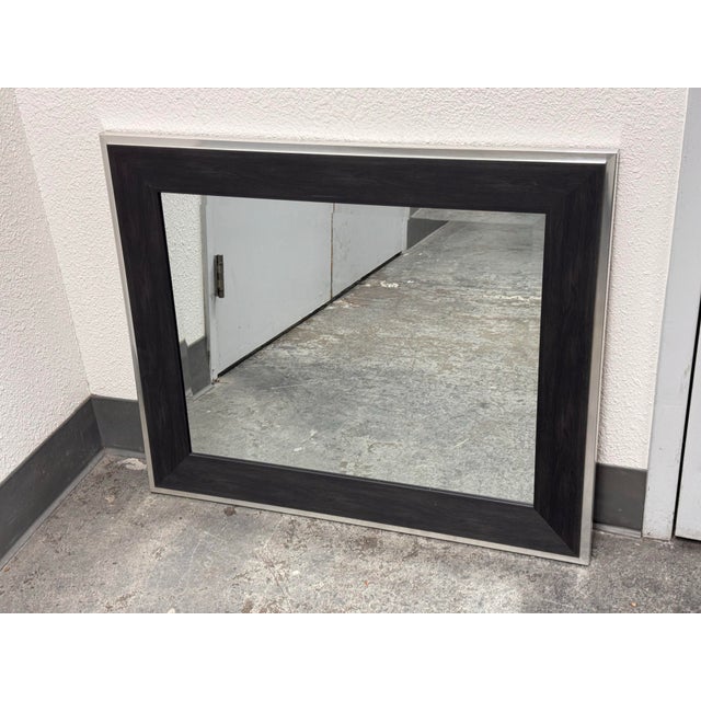 Design Plus Gallery presents a Contemporary Rectangular Wall Mirror from BP Industries. This mirror showcases a wide black...