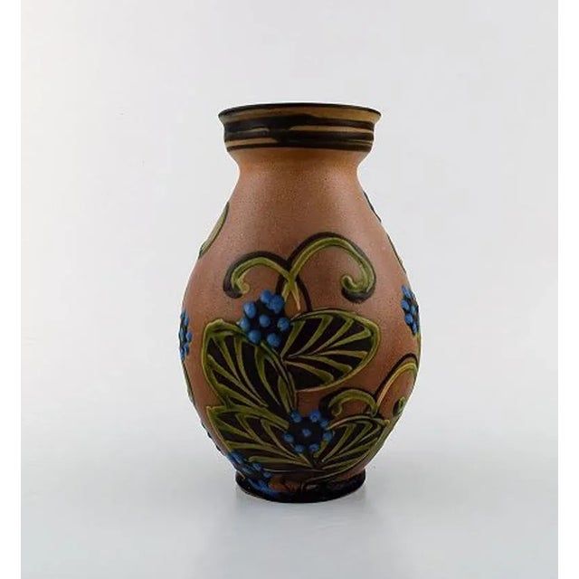 Kähler, HAK, glazed stoneware vase in modern design, 1930s-1940s. Cow Horn technique. Flowers on brown background....