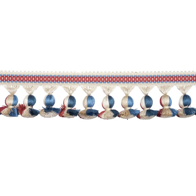 Ali Tassel is a stylish striped tape with multicolored onion fringe. Use this lustrous textural trim to imbue upholstered...