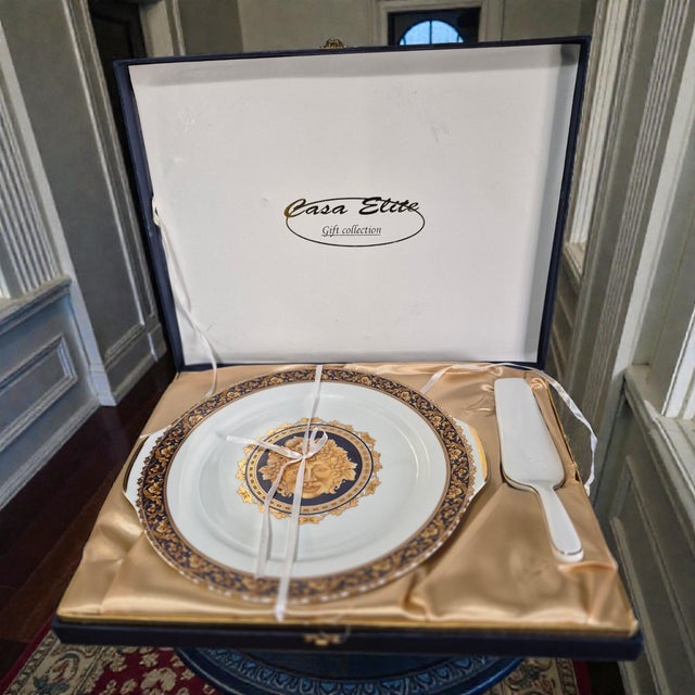 The Bacchus T. Limoges France Cake Plate & Spatula from the Milano Collection is a beautifully crafted dessert plate made...