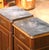 Elegant and highly functional, this pair of antique bedside cabinets provides generous storage within a tall and narrow...