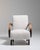 Upholstered armchair in Ivory Boucle. Its ivory boucle finish sets off curved wooden arms, gently tapered legs, soft ivory...