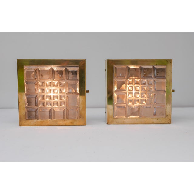 A pair of Scandinavian Brutalist wall lamps by Falkenbergs Belysning, Sweden, circa 1967. These striking sconces are an...