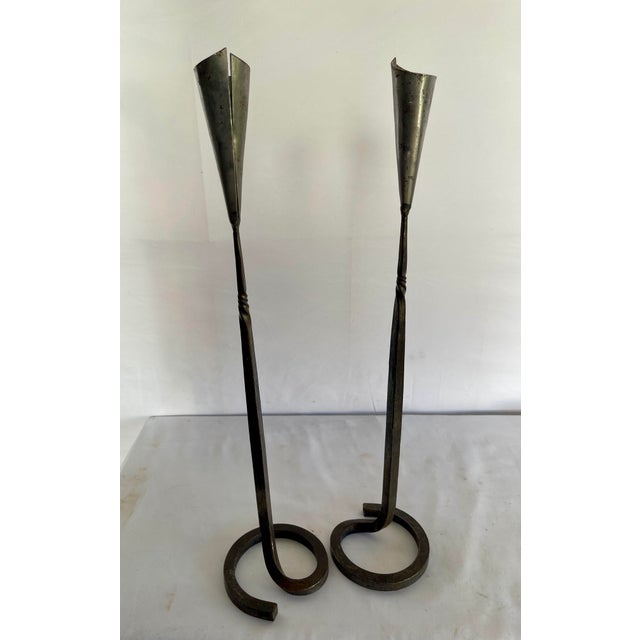 "A remarkable pair of hand forged candlesticks by Belltrees Forge - the celebrated Scottish artisan blacksmiths whose work...