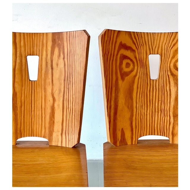 A pair of Brutalist pine chairs, completely in the style of Goran Malmvall. In good vintage condition, with some signs of...