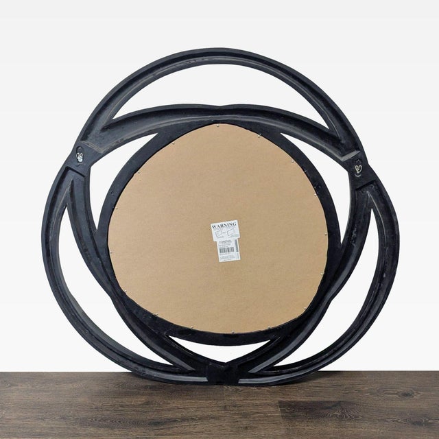 This mirror features interlinking loops with contrasting silver and high gloss black finishes. Brand: Coaster. Original...