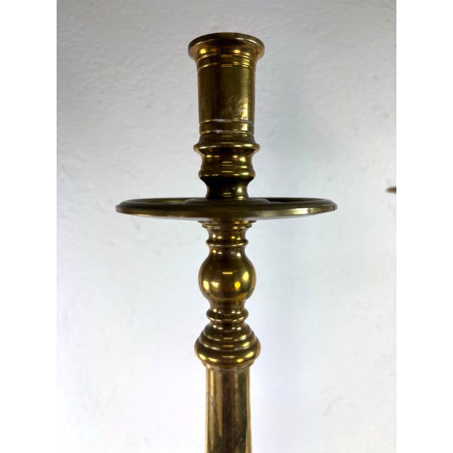 This is a large pair of elegant solid breast candlesticks by Maitland Smith. These candlesticks have a large elegant...