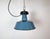 Industrial blue enamel pendant light made by Polam Wilkasy in Poland during the 1960s. White enamel inside the shade. Cast...