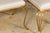 A pair of French gilt metal benches from the Midcentury period, with cabriole legs, pad feet and new custom linen...