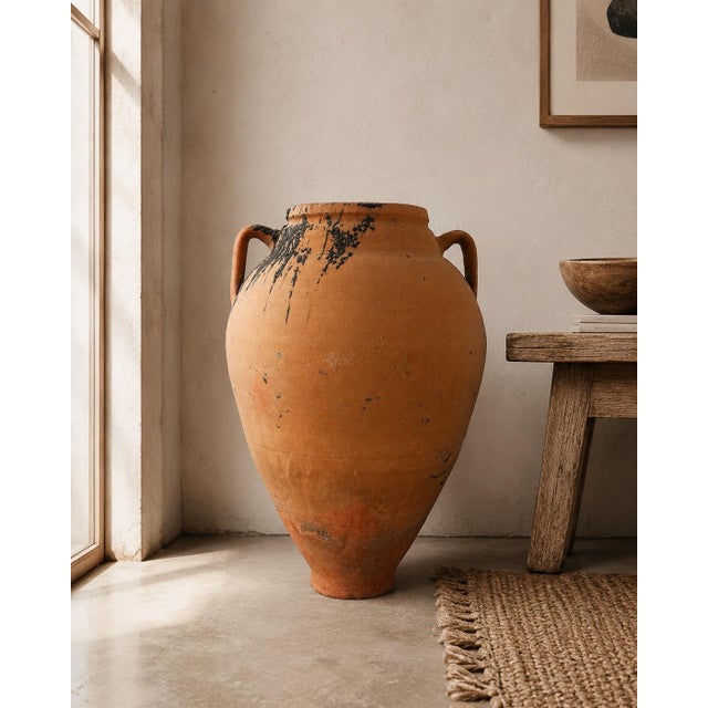 Originally used to store oils, water, and other liquids or foods, this antique vessel is not modernly water safe and...