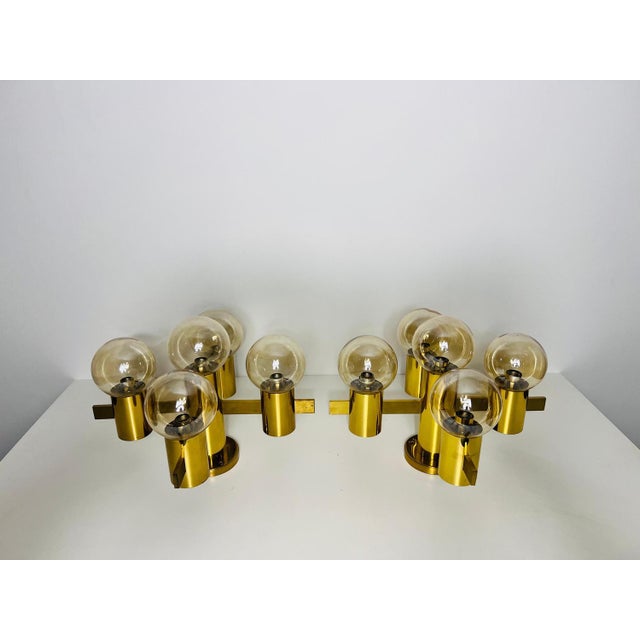 This exquisite brass and glass chandelier, designed by the renowned swedish designer hans-agne jakobsson in the 1960s, is...