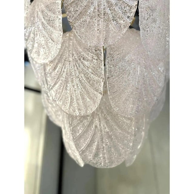 Luxury modern gold 24k chandelier with white graniglia “petals” in murano glass. hand-made in murano glass , all made in...