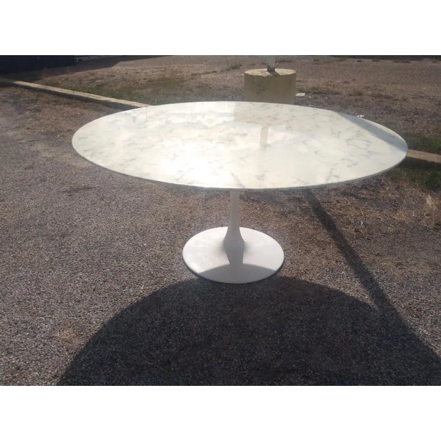 60" marble top Saarinen Style Tulip Table Saarinen style pedestal dining table with heavy aluminum base.