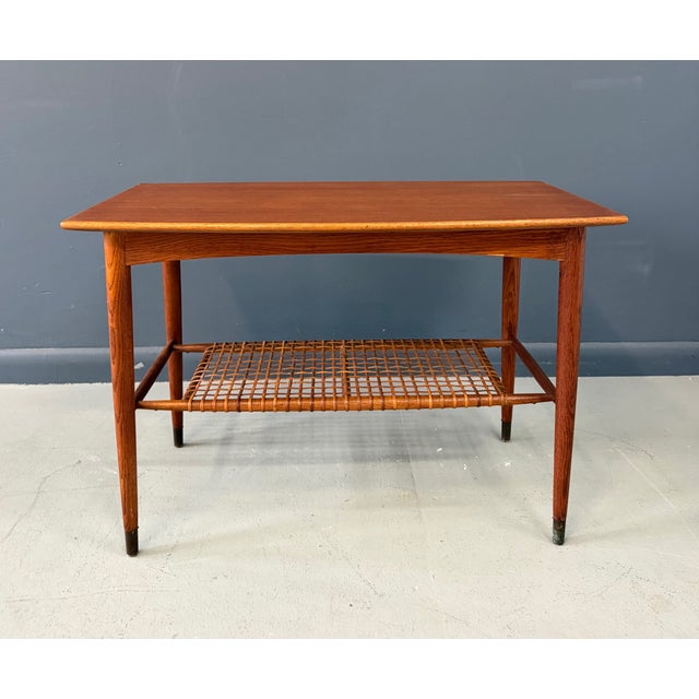 A very elegant and refined side table with beautifully curved sides designed by Folke Ohsson for Dux, Sweden. Teak with...