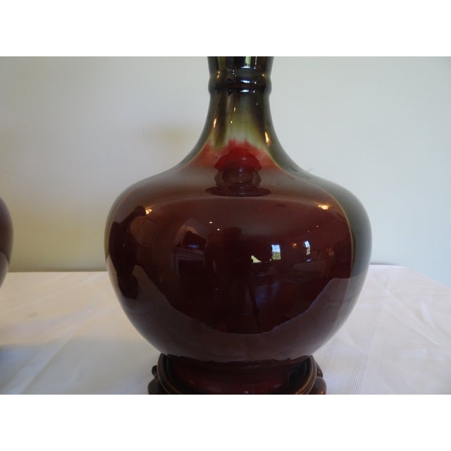 Chinese Vintage Flambe Sang De Douf Vases With Rosewood Stands For Sale - Image 3 of 4