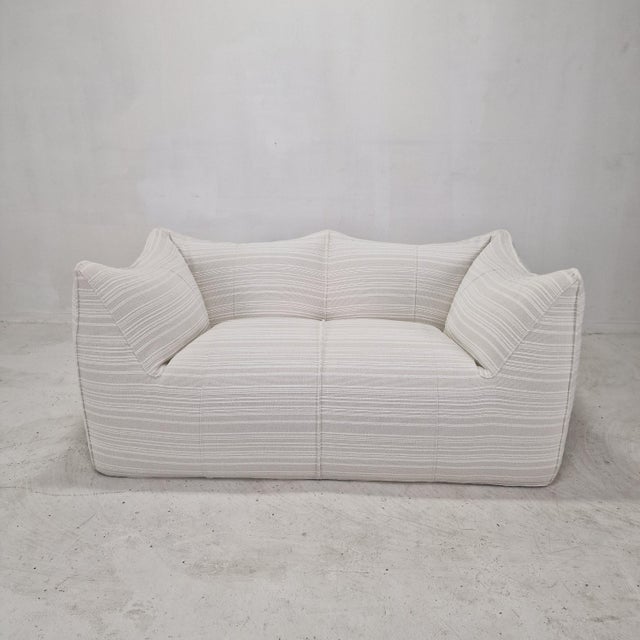 Iconic "le bambole" two-seat sofa by b&b italia, originally designed in 1972 by mario bellini and widely regarded as one...